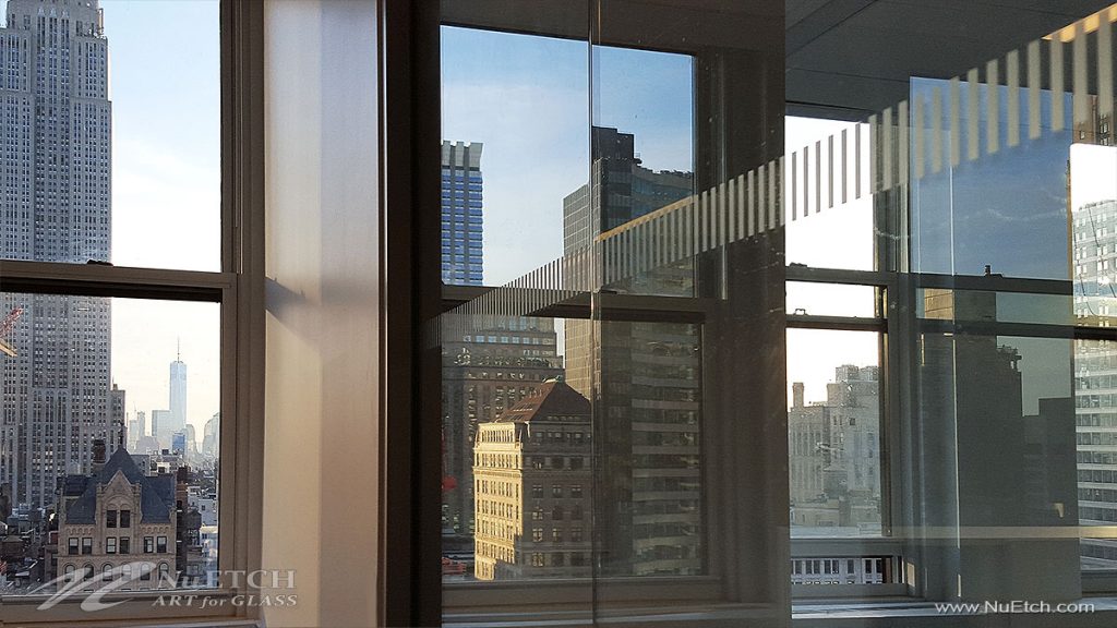 Distraction Markers on glass panels and doors in commercial space is required by law in NYC